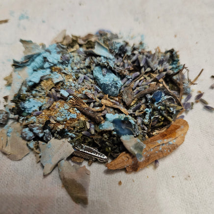 Mixture of dried herbs and spices on a beige surface