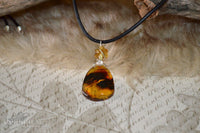 Amber pendant - leather cord