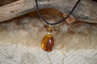 Amber pendant - leather cord