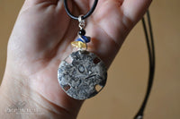 Fossil pendant - leather cord